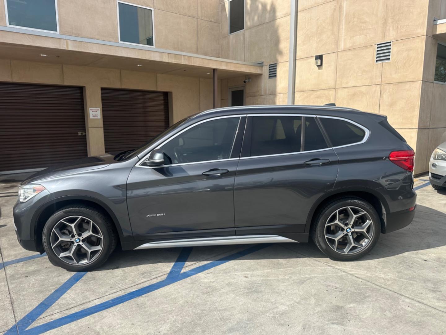 2016 Gray /Black BMW X1 leather (WBXHT3Z34G4) with an 4 CYLINDER engine, Automatic transmission, located at 30 S. Berkeley Avenue, Pasadena, CA, 91107, (626) 248-7567, 34.145447, -118.109398 - Crown City Motors is a used “Buy Here Pay Here” car dealer in Pasadena CA. “Buy Here Pay Here” financing, means that when you purchase your vehicle from our dealership, that you make the payments to the dealership as well. We do not need the banks approval to get you approved for a used auto - Photo#2